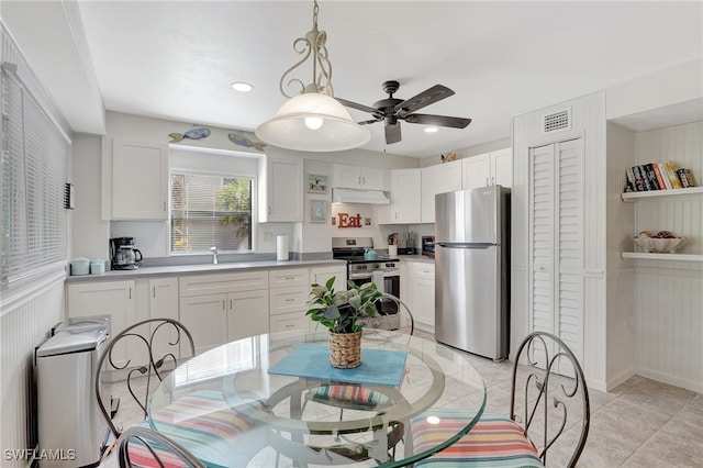 kitchen featuring white cabinetry, sink, and appliances with stainless steel finishes