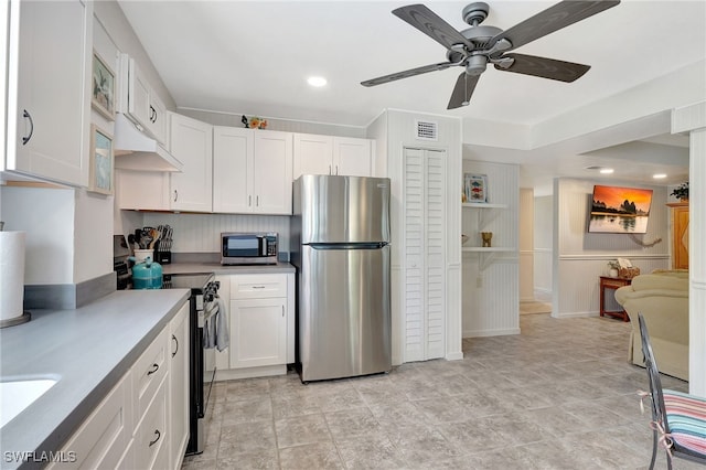 kitchen featuring stainless steel appliances, white cabinetry, and ceiling fan