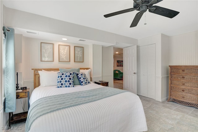 tiled bedroom featuring ceiling fan