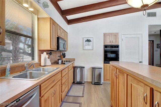 kitchen featuring tasteful backsplash, sink, black appliances, light brown cabinets, and light wood-type flooring