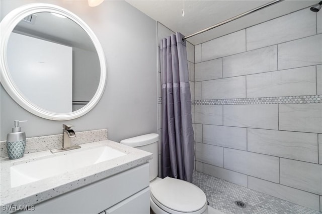 bathroom with walk in shower, vanity, and toilet