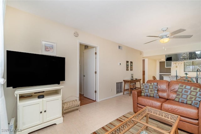 living room featuring ceiling fan