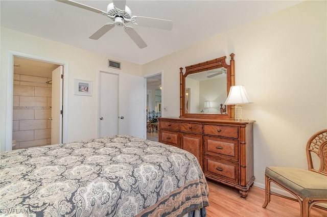 bedroom featuring ceiling fan, connected bathroom, and light wood-type flooring