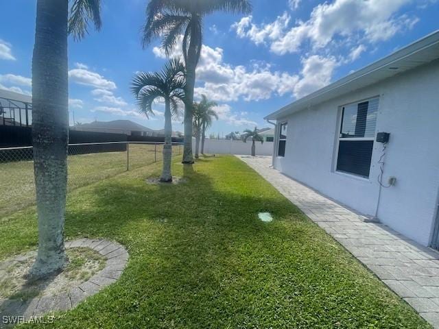 view of yard with fence