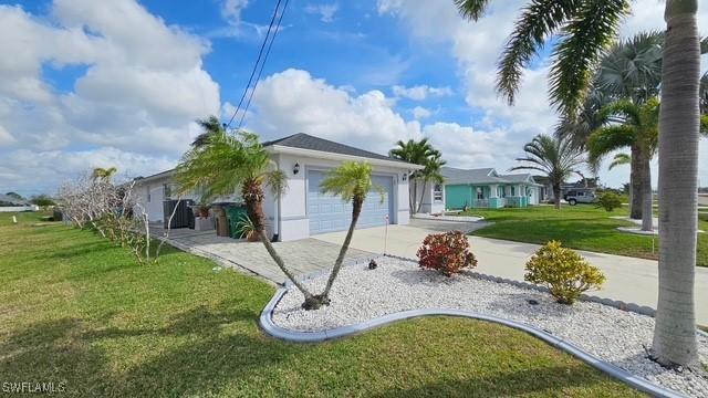 ranch-style house with a garage, driveway, and a front lawn