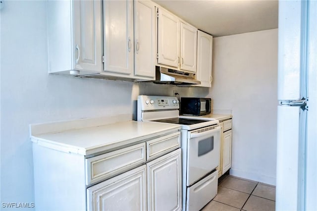 kitchen featuring white cabinetry, white appliances, and light tile patterned flooring