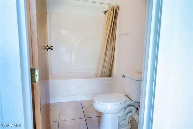 bathroom featuring tile patterned floors, toilet, and shower / bath combo