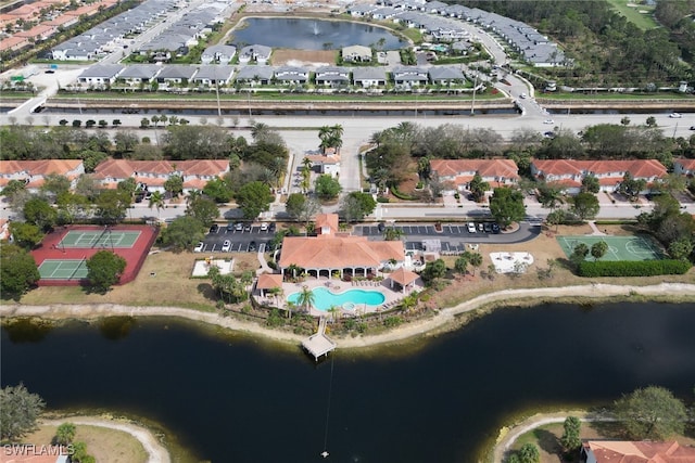 birds eye view of property featuring a water view