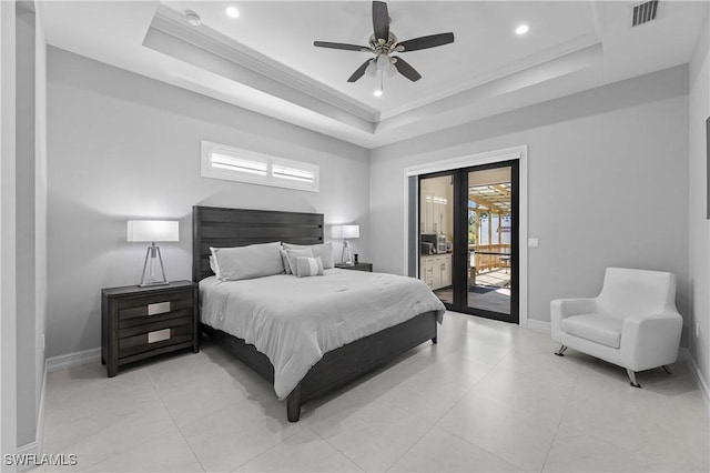 bedroom with crown molding, access to exterior, and a tray ceiling