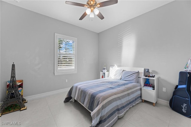 bedroom featuring light tile patterned flooring and ceiling fan