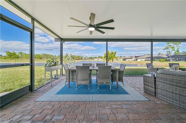 unfurnished sunroom featuring a wealth of natural light and ceiling fan