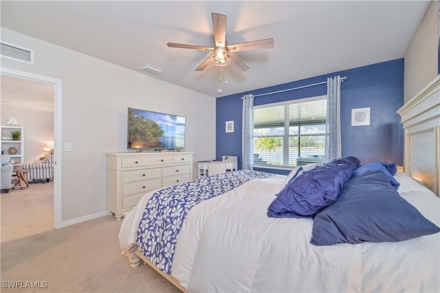 bedroom with light colored carpet and ceiling fan