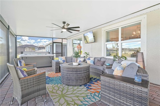 8908 Cascade Price Cir, North Fort Myers, FL 33917 - sunroom featuring a jacuzzi, ceiling fan, and an outdoor hangout area