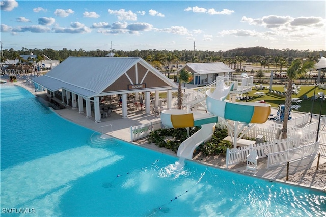 view of pool featuring a patio and a water slide