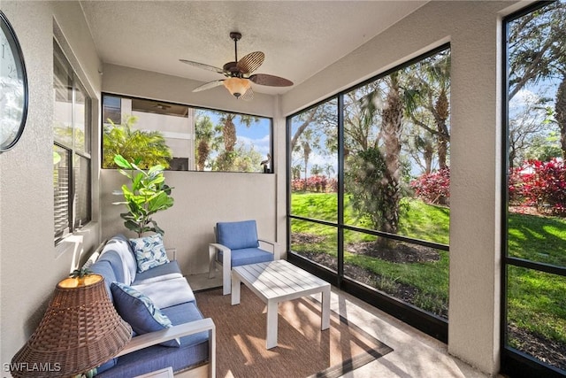 sunroom featuring a wealth of natural light and ceiling fan