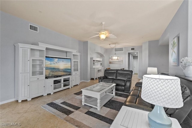 living room with ceiling fan and light tile patterned floors