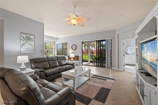 living room featuring light tile patterned floors and ceiling fan