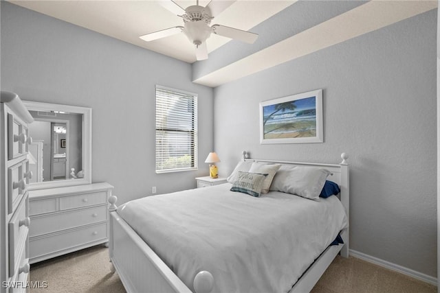 bedroom featuring ceiling fan and light carpet