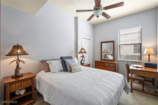 carpeted bedroom with ceiling fan