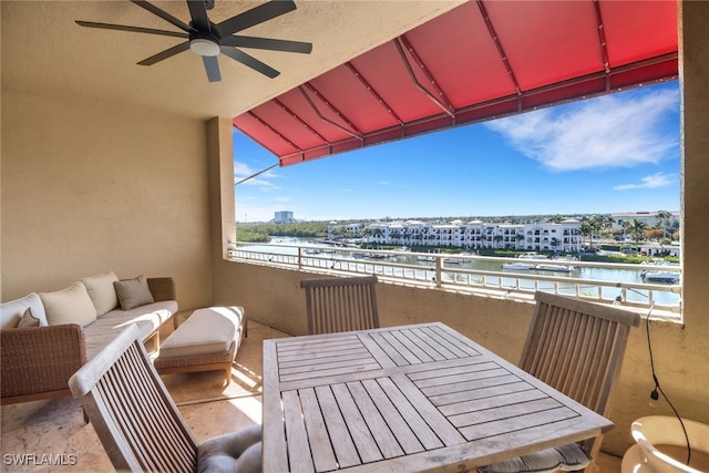 balcony with a water view and outdoor lounge area