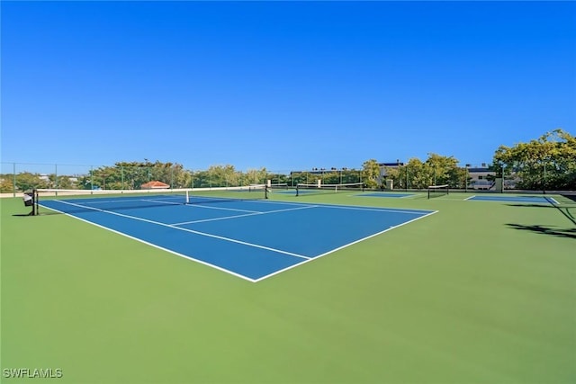 view of tennis court featuring basketball court