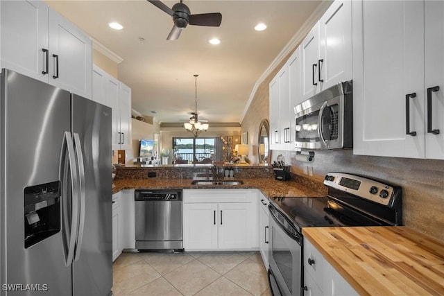 kitchen featuring sink, stainless steel appliances, and white cabinets