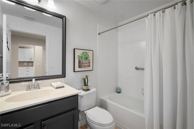 full bathroom featuring vanity, shower / tub combo, and toilet