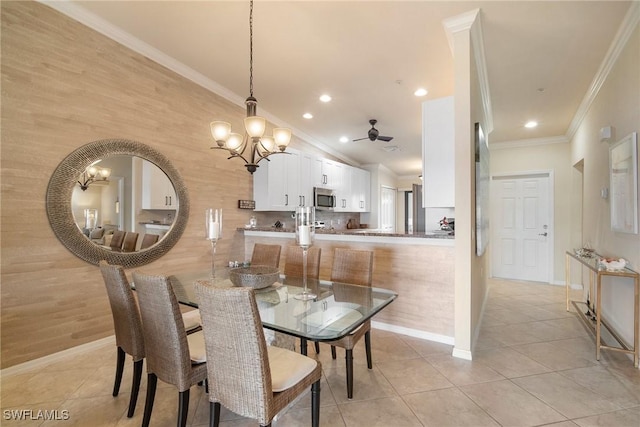 dining area featuring light tile patterned floors and crown molding