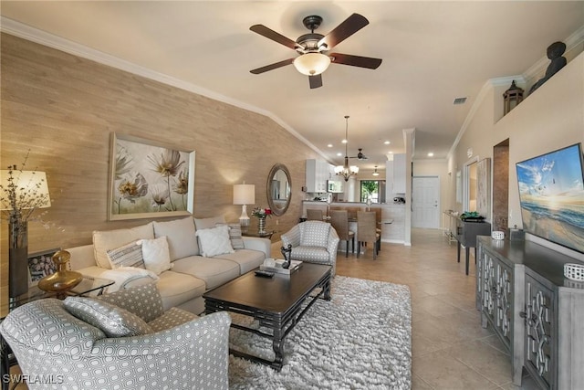 living room featuring crown molding, vaulted ceiling, ceiling fan with notable chandelier, and light tile patterned floors