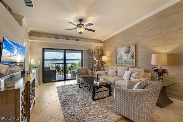 tiled living room featuring crown molding, vaulted ceiling, and ceiling fan