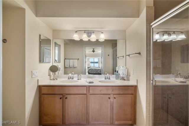 bathroom featuring vanity and an enclosed shower