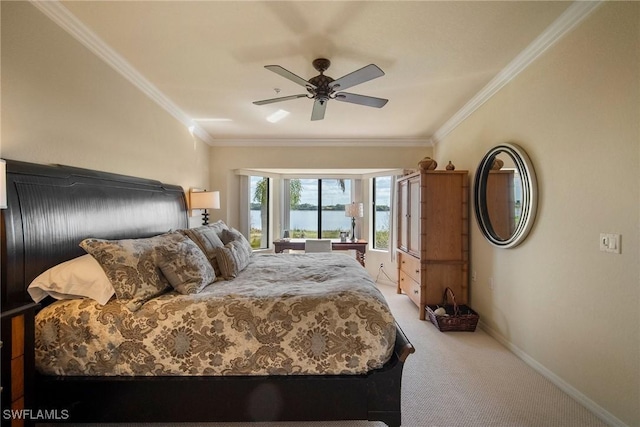 bedroom featuring ornamental molding, carpet floors, and ceiling fan