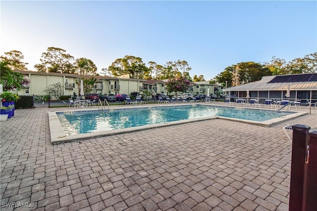 view of swimming pool featuring a patio area