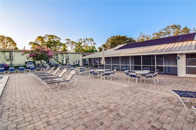 view of patio with a sunroom