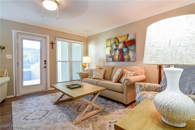 living room featuring crown molding, ceiling fan, and hardwood / wood-style floors