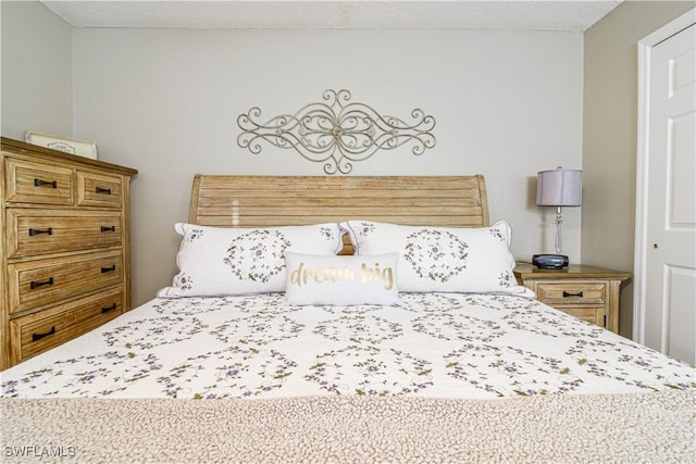 bedroom featuring a textured ceiling