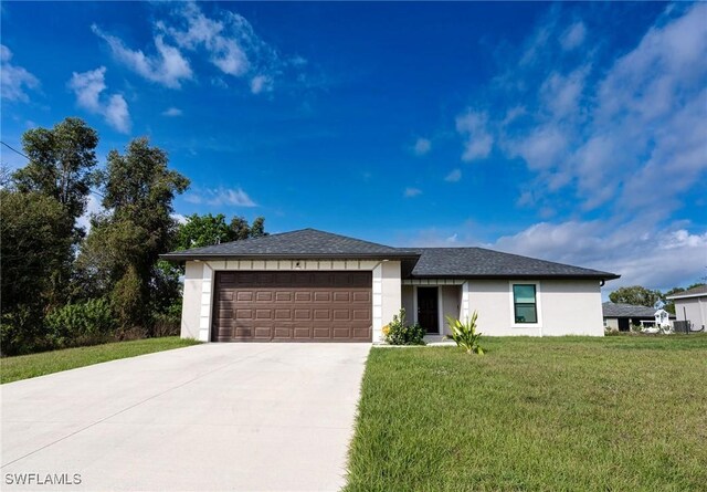 view of front facade with driveway, a front lawn, an attached garage, and stucco siding