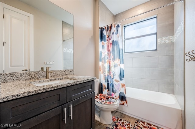 full bathroom with vanity, hardwood / wood-style floors, shower / bath combination with curtain, and toilet