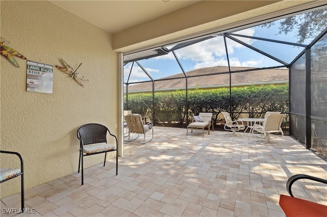 view of patio / terrace with a lanai