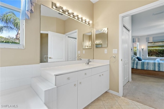 bathroom with vanity and tile patterned flooring