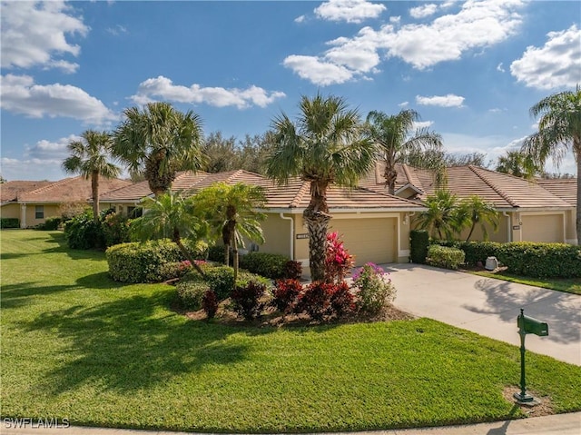 view of front of property featuring a garage and a front yard