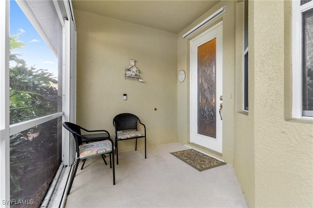 entrance to property with a balcony