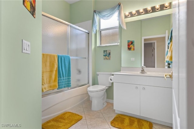 full bathroom with toilet, tile patterned floors, bath / shower combo with glass door, and vanity