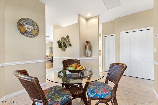 dining space with light tile patterned floors