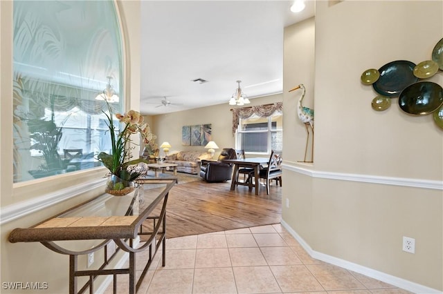 tiled dining room with ceiling fan