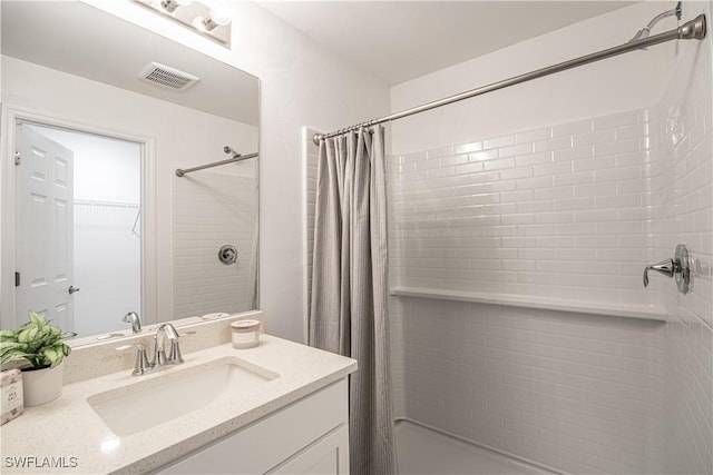 full bath with curtained shower, visible vents, and vanity