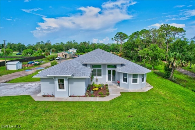 back of house with a yard