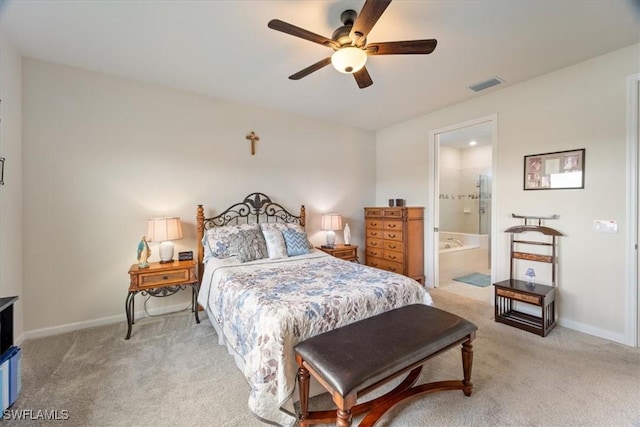 bedroom with light carpet, connected bathroom, and ceiling fan