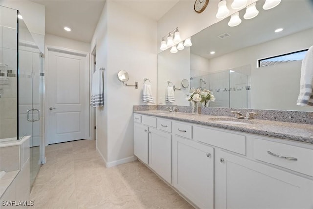 bathroom with vanity and walk in shower
