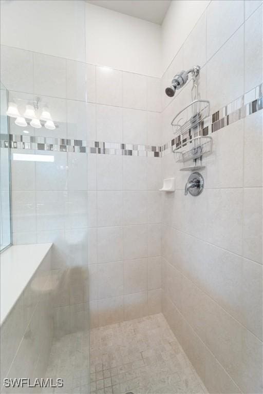 bathroom featuring a tile shower